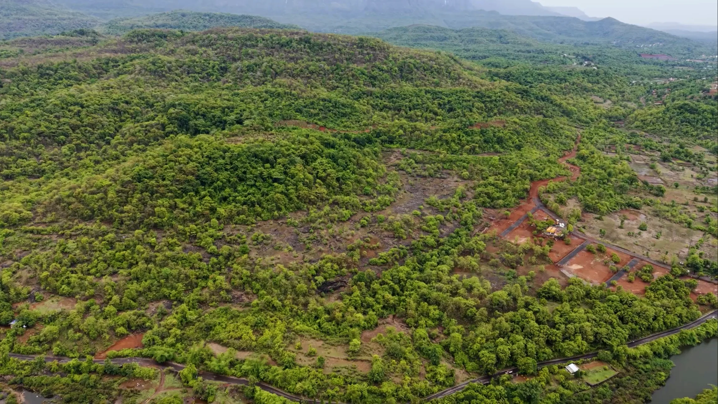 Aerial view of the Elements site set into the forested Sahyadri hills at Pali Khopoli